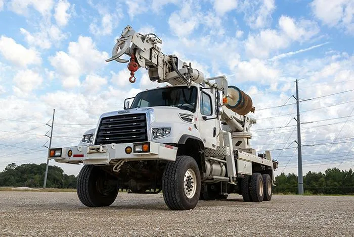 Freightliner 114SD con grúa